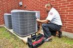 Technician repairing an air conditioner